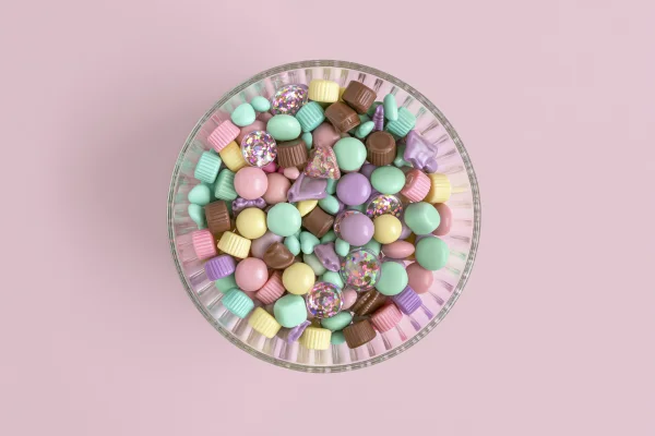 パステルカラーのチョコ菓子とピンクの背景の壁紙 - かわいい / 暮らし・食べ物