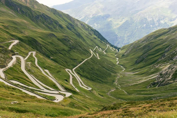 Winding Switchback Road on Green Slopes - Nature & Landscape wallpaper