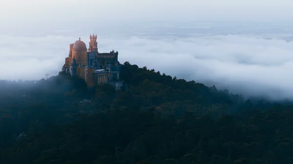 Red Castle Atop a Dark Wooded Hill - Nature & Landscape / Heritage & Ruins wallpaper