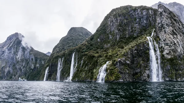 White Waterfalls on Green Fjord Cliffs - Sea, Lakes & Water wallpaper