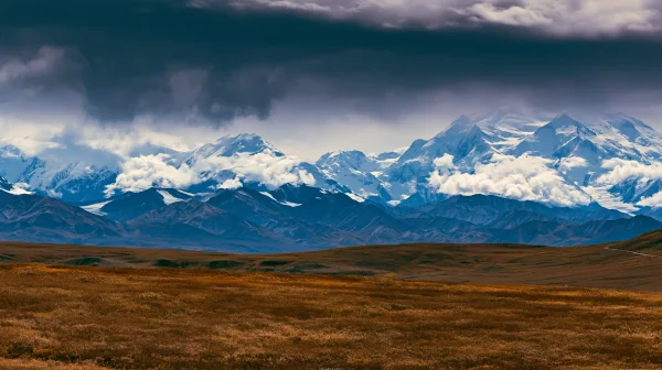 Blue Snow Mountains and Moor under a Dark Sky - Nature & Landscape wallpaper
