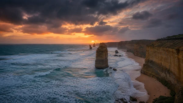 Sea Stacks Beneath a Fiery Sunset - Orange 4K - Sea, Lakes & Water / Sky, Stars & Sunsets wallpaper